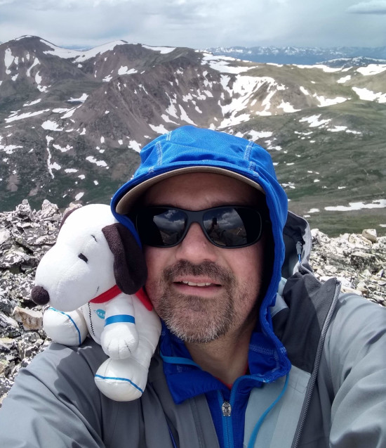 Profile Picture of Adrián Moreno (@zetxek), working side by side with a colleague: sitting on a desk, while looking at a screen